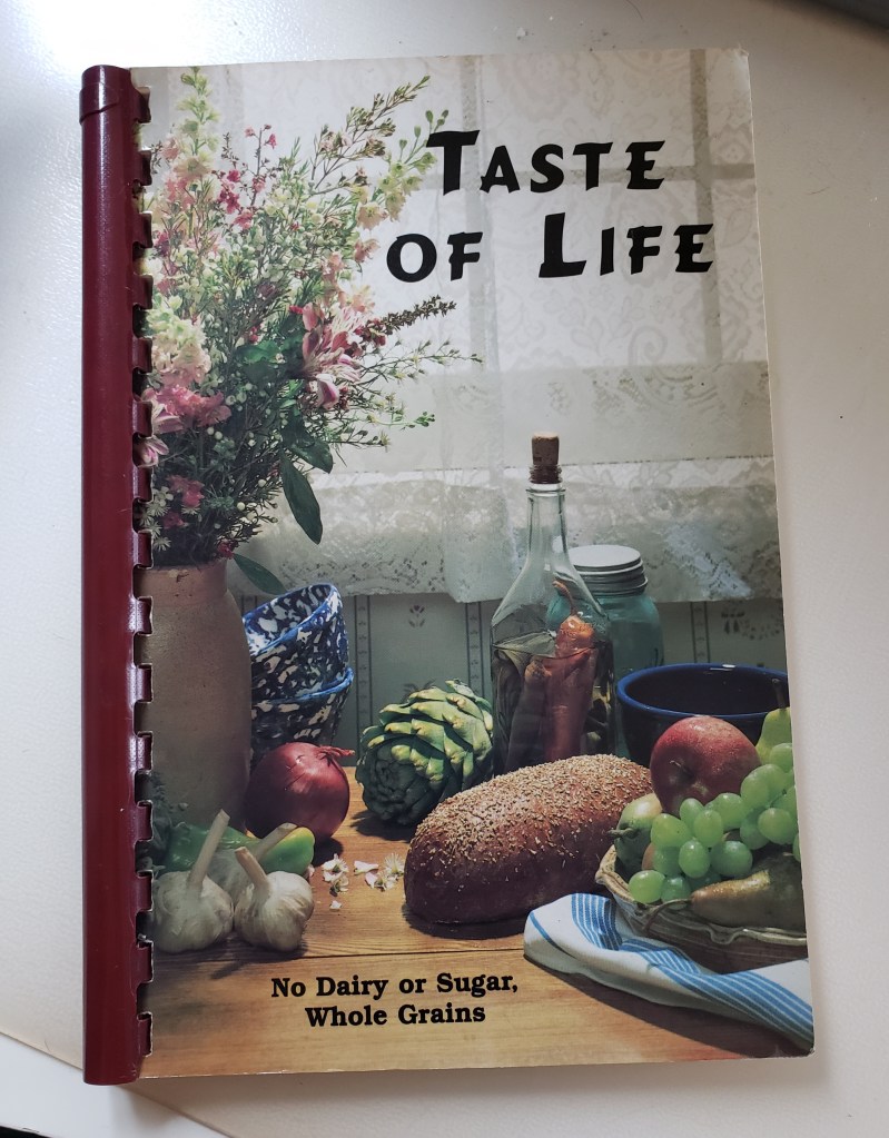 A cookbook cover, titled "Taste of Life" No Dairy or Sugar, Whole Grains. 
