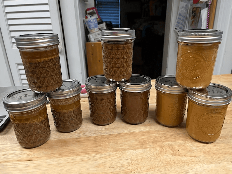 Mason jars filled with creamy nut butter. 